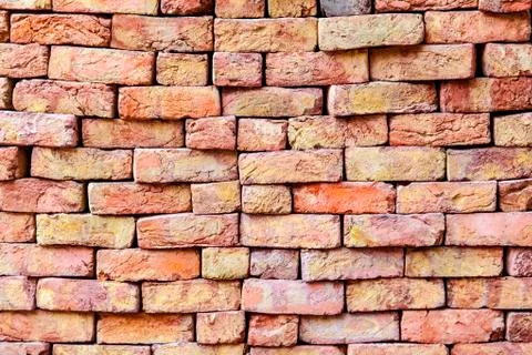 Stapled bricks give a harmonic pattern in red Stock Photos