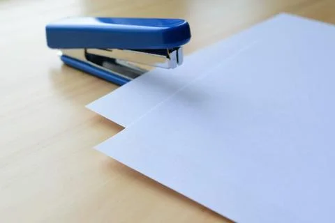 A stapler and blank sheets of paper Stock Photos