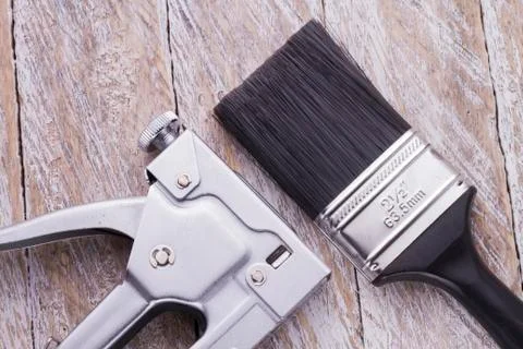 Stapler and brush on the table Foto stock