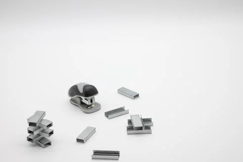 Stapler and staples on a white background Stock Photos