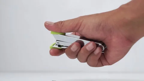 The stapler that is being operated is functioning properly Video stock 272713377