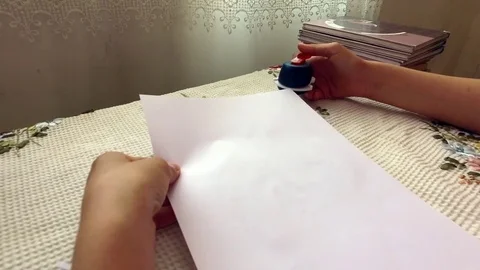 Stapler broke down, the girl at the table. Stock Footage 78990567