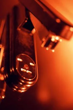 Stapler Close-Up with Dark Orange Lighting Stock Photos