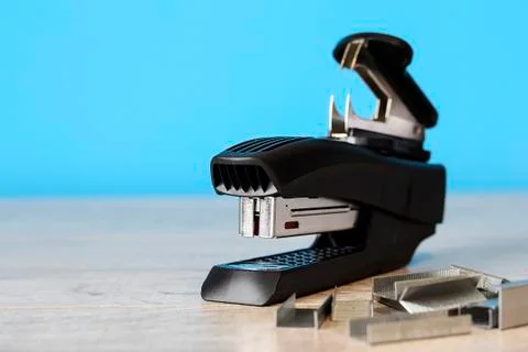 Stapler for office work on the table. Stationery item. Office su Stock Photos
