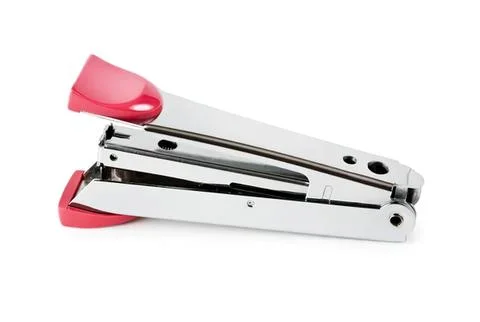 Stapler with pink and silver metal body on white background Stock Photos