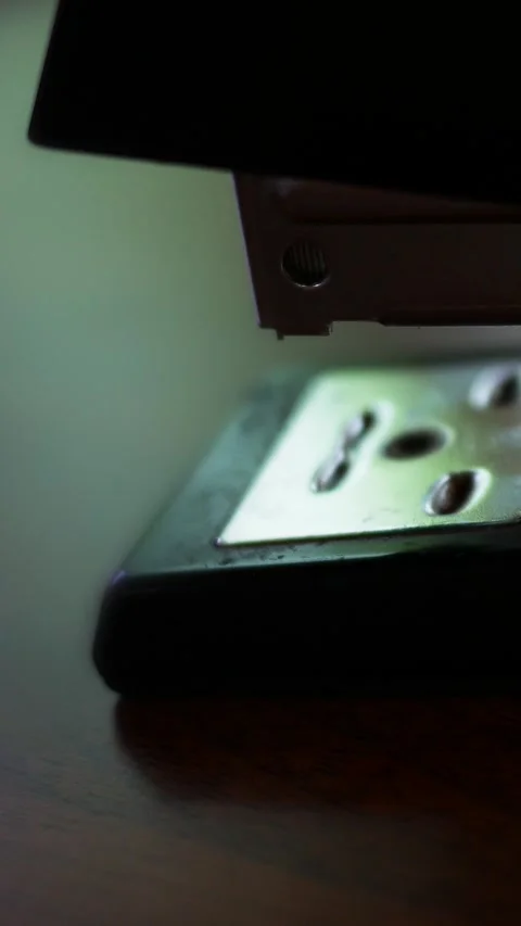A Stapler Staples a Document Together for Filing - Cinematic - Vertical 2 Stock Footage 333706764