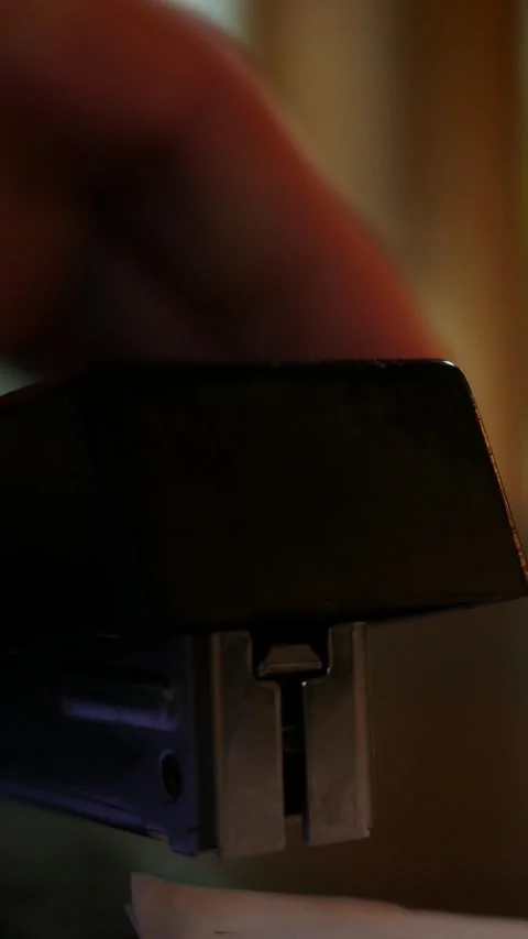 A Stapler Staples a Document Together for Filing - Cinematic - Vertical Stock Footage 333706814
