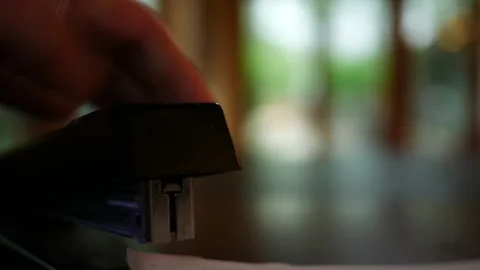 A Stapler Staples a Document Together for Filing - Cinematic 2 스톡 동영상 333706825