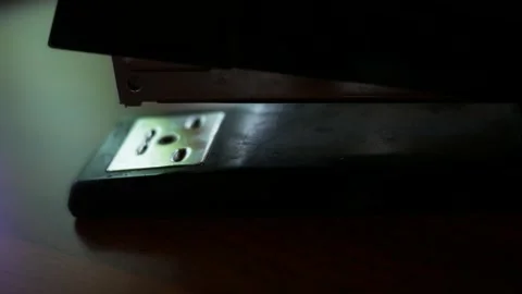 A Stapler Staples a Document Together for Filing - Cinematic 動画素材 333706868