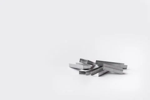 Stapler staples isolated on a white background. Close-up. Copy space. Space f Stock Photos