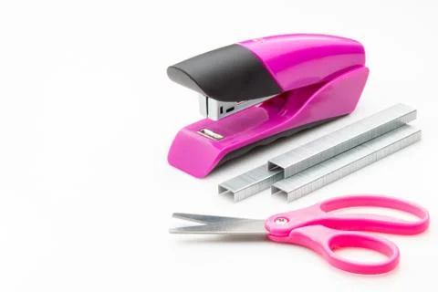 Stapler with staples on scissors on a white background. Stock Photos
