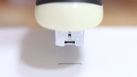 Stapler staples sheets of paper Stock Footage 145430412