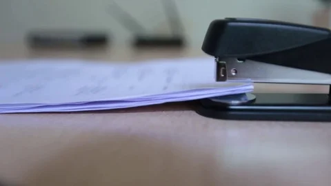 Stapler Stapling Papers, Documents on Desk in Office - Close Up Stock Footage 73672959