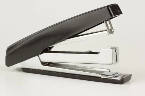 Stapler for stapling papers on a table Stock Photos