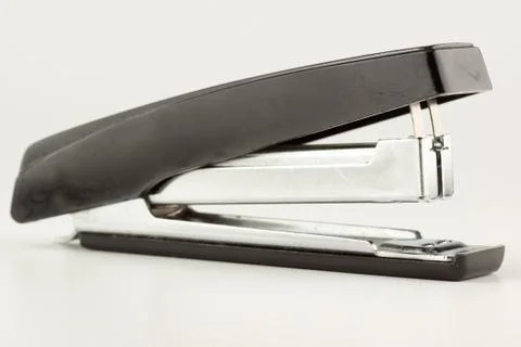 Stapler for stapling papers on a table Stock Photos