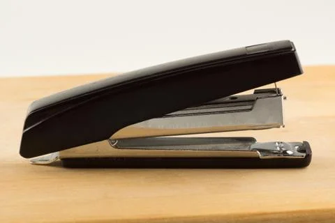 Stapler for stapling papers on a table Stock Photos