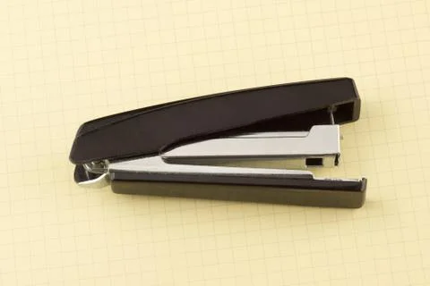 Stapler for stapling papers on a table Stock Photos
