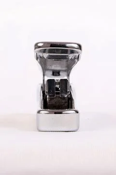 A stapler used to attach a bunch of papers Stock Photos