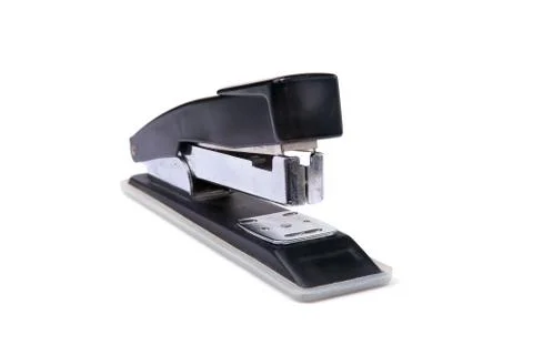 The stapler is used in the office to manually connect paper. Stock Photos
