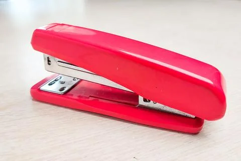 Stapler on a white desk. Stock Photos