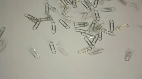 Staples fall on a white surface Stock Footage 14808609