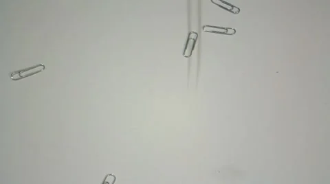 Staples fall on a white surface Stock Footage 14808613
