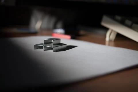 Staples as geometric shapes on a surface under directional light Stock Photos