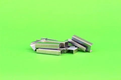 Staples on isolated green Stock Photos