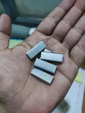 Staples over the hand Stock Photos