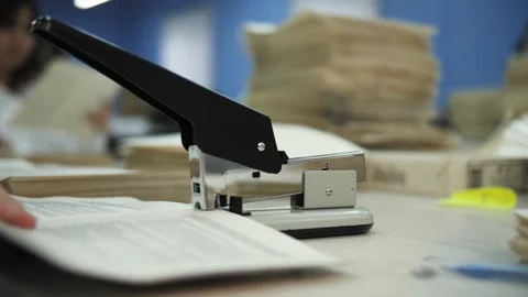 Stapling documents in an office Stock Footage 301409299