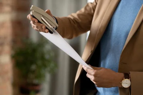 Stapling top corners of documents 写真素材