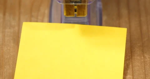 Stapling yellow post it papers with stapler Видео 162612070