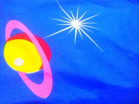 Star and moon pattern on blue bed sheets Stock Photos