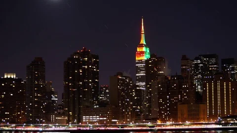 Star and Moon Trails setting next to the Empire State Building in New York City Stock Footage 71130181