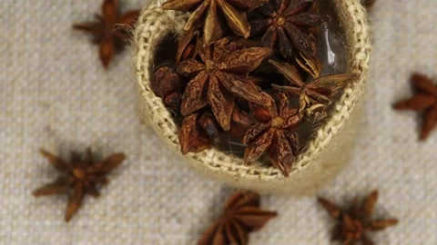 Star anise isolated rotating on bag in blurry background. Herbs and spices. Stock Footage 282591075