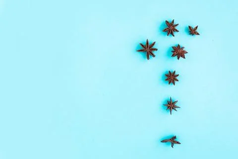 Star anise pattern on blue background, minimal concept, copy space for the te Stockfoto's