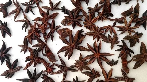 Star anise rotating full frame background, top view looped spinning, close up Video stock 279243190