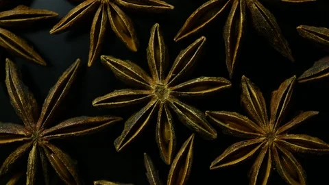 Star anise spin on black background closeup Stock Footage 121521825