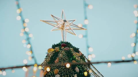The star of Bethlehem on top of the Christmas tree Stock Footage 226971234