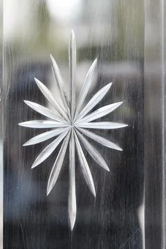 Star burst pattern engraved on a glass surface Stock Photos