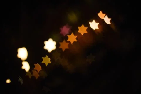 Star of David light Bokeh Effect Dark Black Background Stock Photos