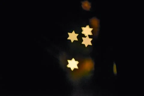 Star of David light Bokeh Effect Dark Black Background Stock Photos
