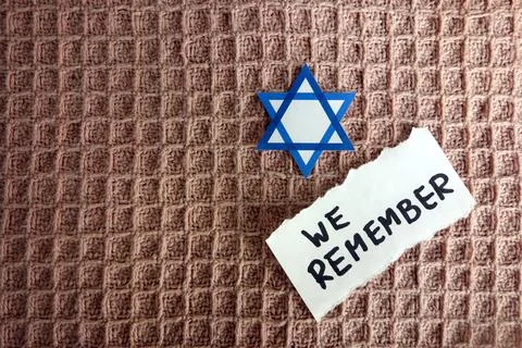 Star of David with text we remember, Holocaust memory day Stock Photos