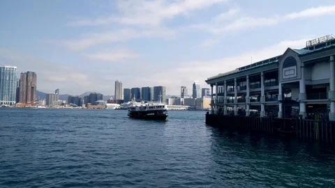 Star Ferry docking at Central Ferry Pier No. 7 in Victoria Harbour, Hong Kong Stock Footage 102876314