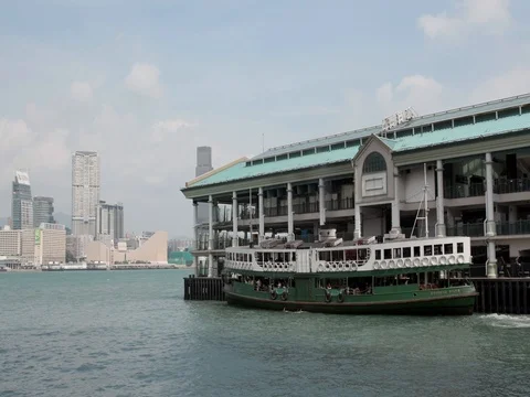 Star Ferry Leaving and Arriving at Central Pier Stock Footage
