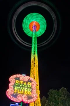 Star Flyer Ride Rollercoaster Tower Spinning Swings Long Exposure Night Stock Photos