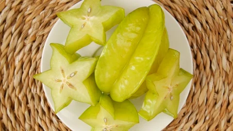 Star fruit on a plate. Stock Footage 245681578