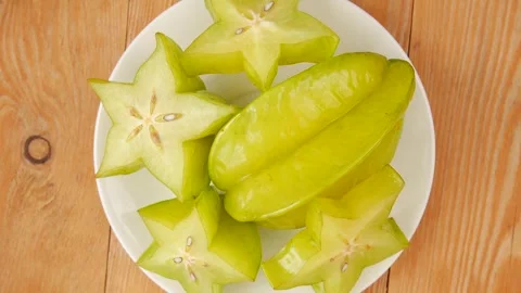 Star fruit on a plate. Video stock 246781912