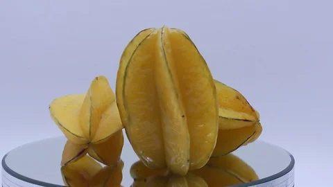 Star fruit on white background rotating Stock Footage 124693343