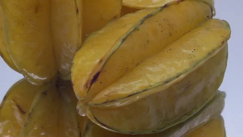 Star fruit on white background rotating Stock Footage 124693452